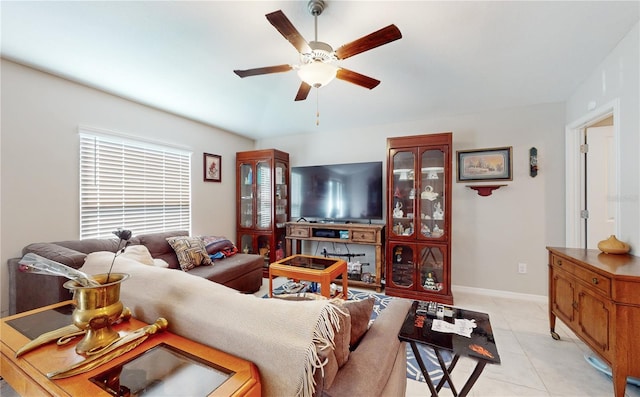 tiled living room with ceiling fan