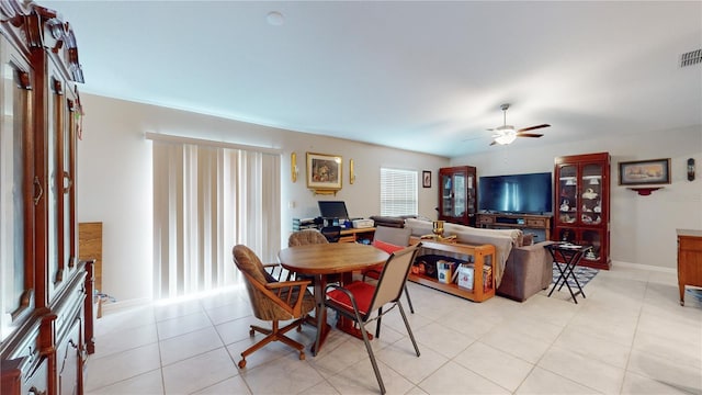 dining room featuring ceiling fan and light tile patterned floors