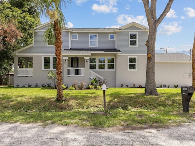 view of front of property featuring a front lawn