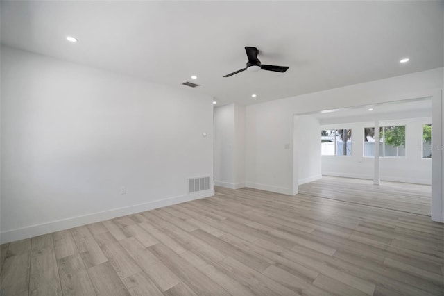 spare room with light hardwood / wood-style flooring and ceiling fan