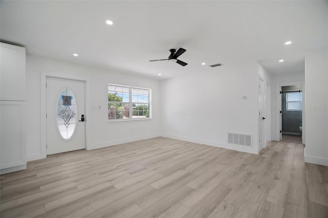 foyer featuring light hardwood / wood-style flooring and ceiling fan