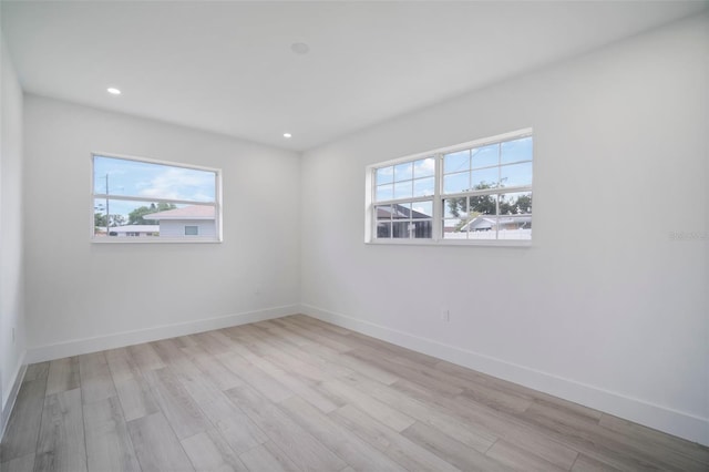 spare room featuring light wood-type flooring