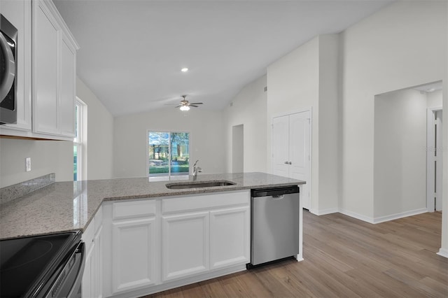 kitchen featuring stainless steel appliances, vaulted ceiling, ceiling fan, sink, and white cabinets