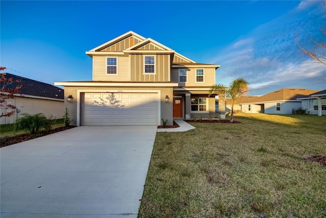 view of front facade with a front yard and a garage