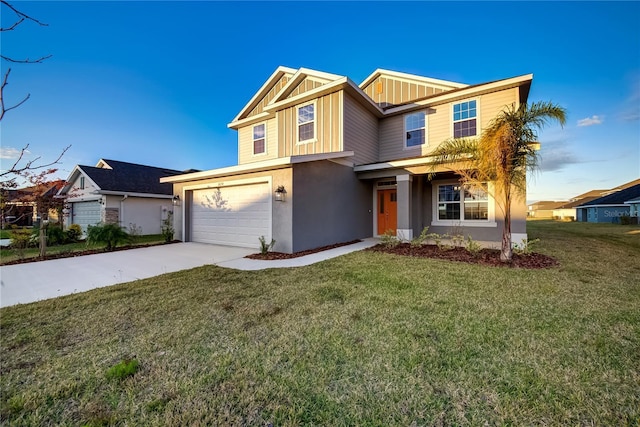 view of front of home with a garage and a front lawn