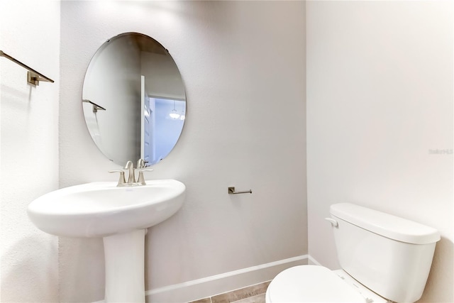 bathroom featuring sink and toilet