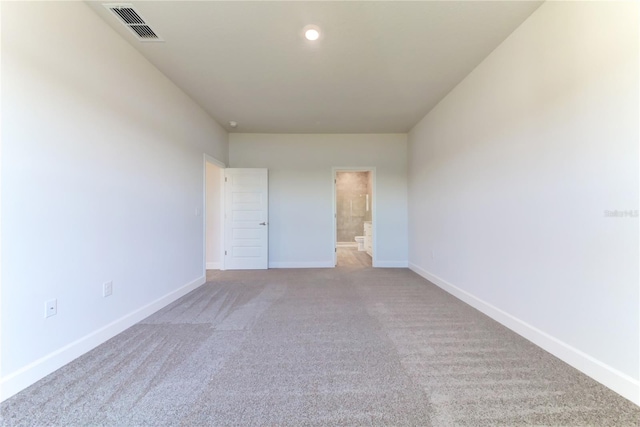 empty room featuring light colored carpet