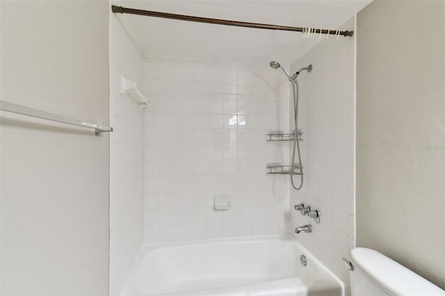 bathroom with shower / bath combination and toilet