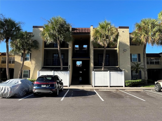 view of property featuring uncovered parking