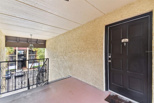 property entrance featuring stucco siding