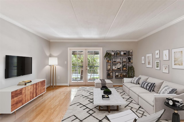 living area with light wood finished floors, french doors, baseboards, and crown molding