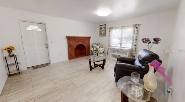 living room featuring a brick fireplace