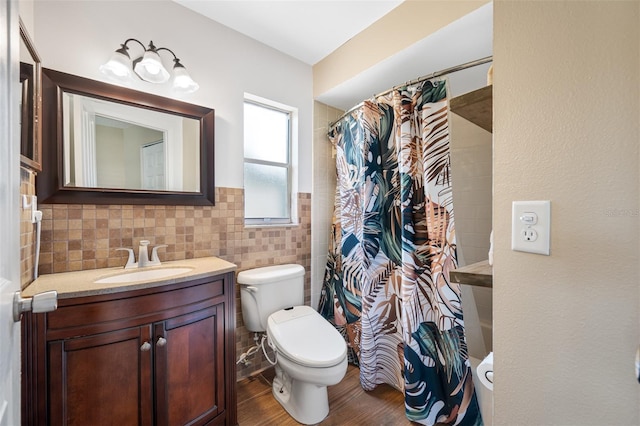 bathroom featuring walk in shower, toilet, vanity, tile walls, and hardwood / wood-style flooring