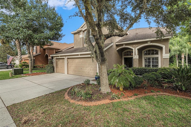 view of front of house featuring a front yard and a garage