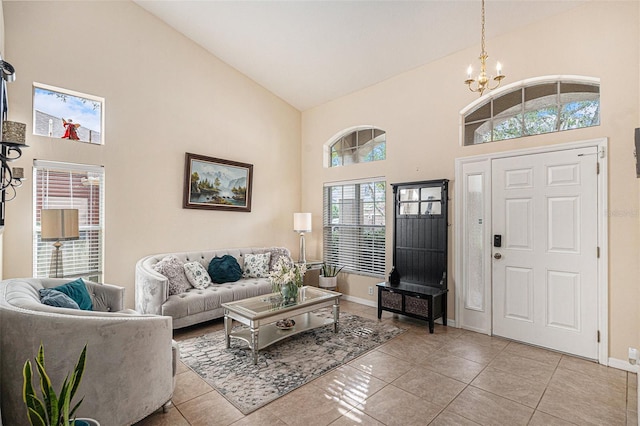 tiled living room with a chandelier and high vaulted ceiling