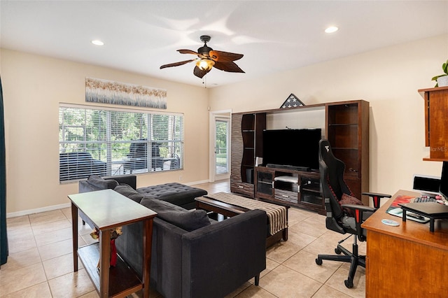 living room featuring ceiling fan and light tile patterned flooring