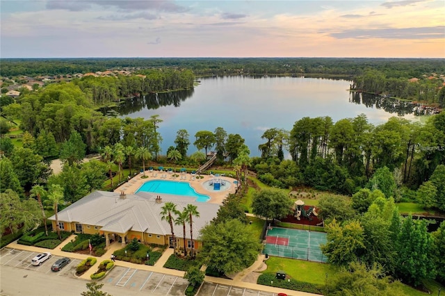 aerial view at dusk with a water view