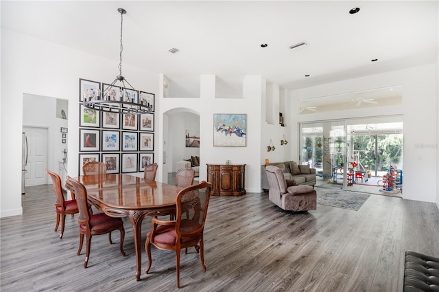 dining room with ceiling fan and hardwood / wood-style floors