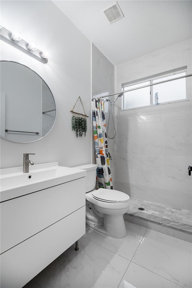 full bathroom featuring visible vents, a shower stall, marble finish floor, toilet, and vanity