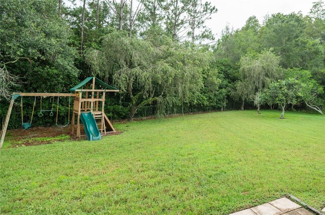 view of yard with a playground