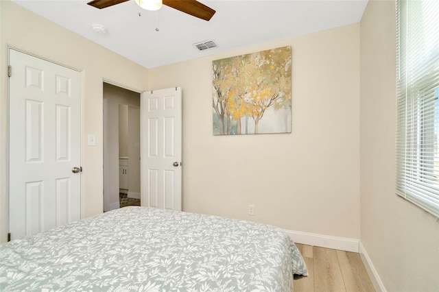 bedroom with ceiling fan and light wood-type flooring