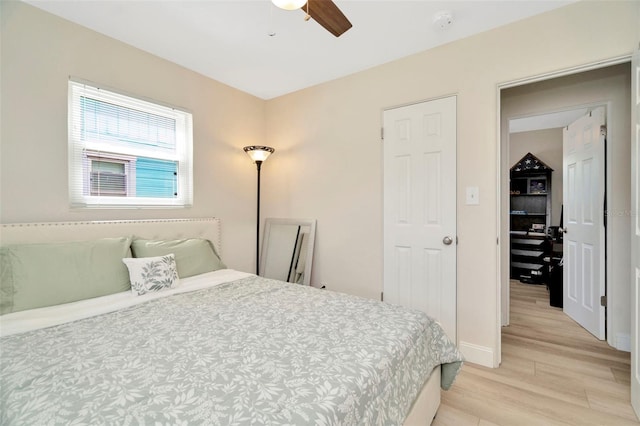 bedroom featuring ceiling fan and light hardwood / wood-style flooring