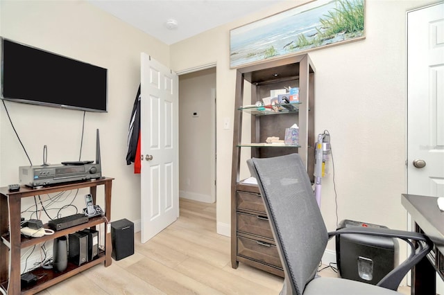 office space with light hardwood / wood-style floors