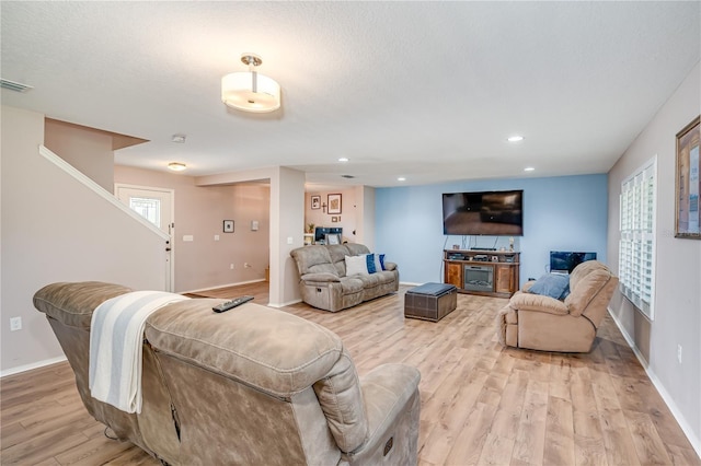 living room with light hardwood / wood-style floors