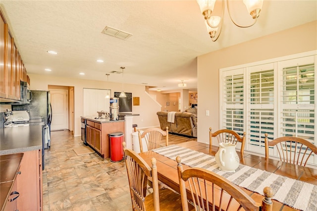 dining room featuring an inviting chandelier