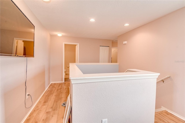 corridor featuring light hardwood / wood-style floors