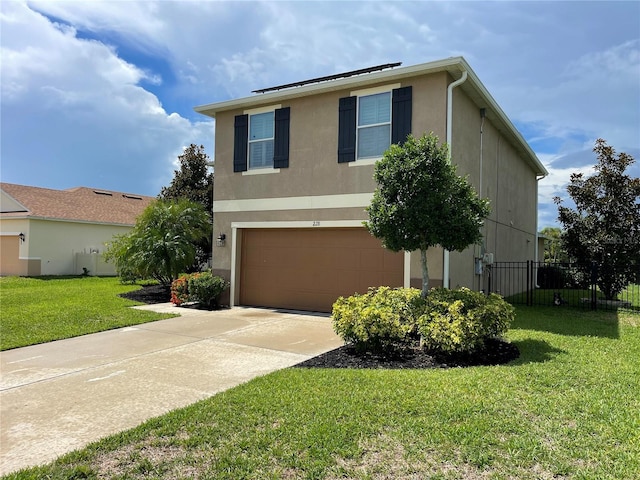 view of front facade featuring a front yard and a garage