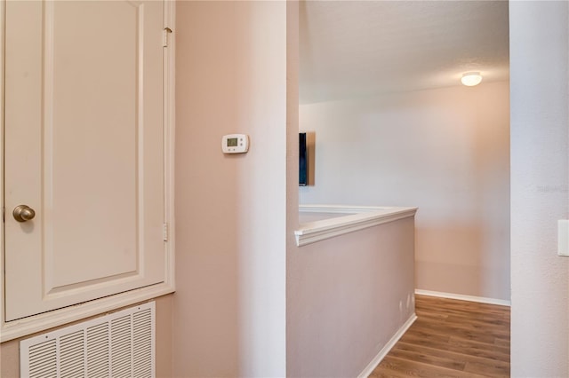 hallway featuring hardwood / wood-style floors