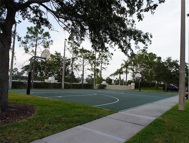view of sport court featuring a yard and community basketball court