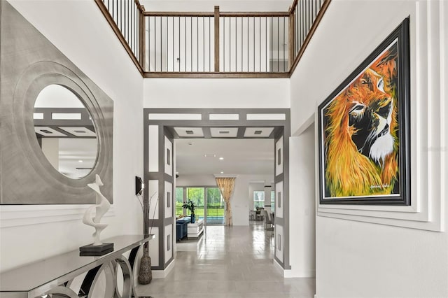 entryway with french doors and a high ceiling