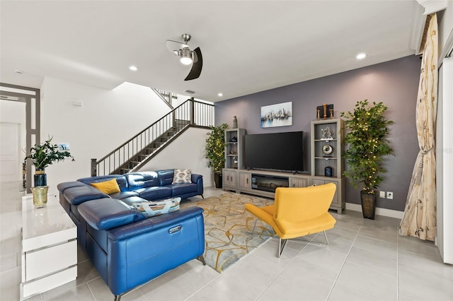 tiled living room featuring ceiling fan