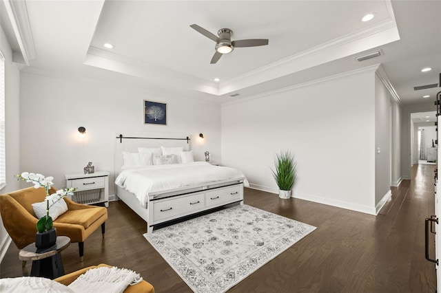 bedroom with a raised ceiling, ceiling fan, crown molding, and dark hardwood / wood-style floors