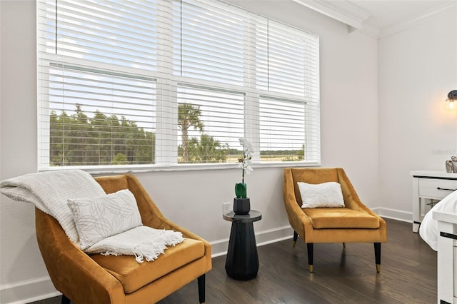 sitting room featuring dark hardwood / wood-style flooring and ornamental molding