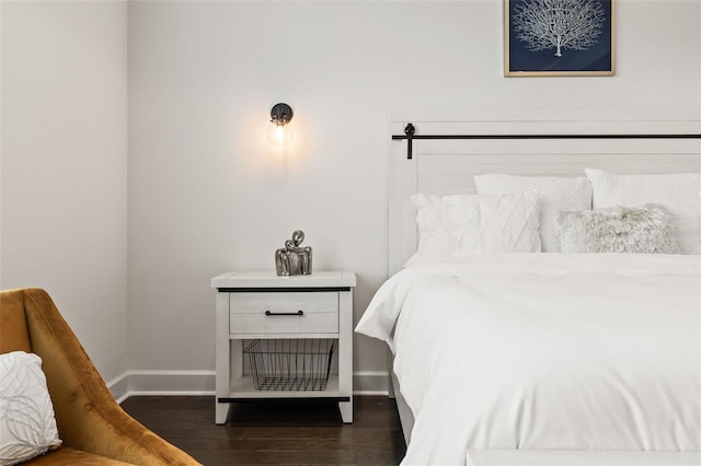 bedroom featuring dark hardwood / wood-style flooring