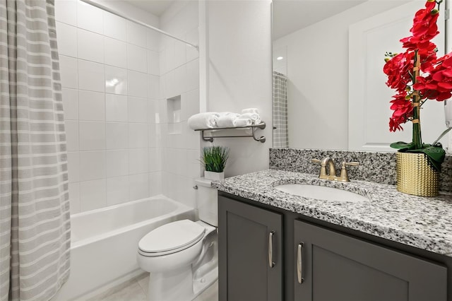 full bathroom featuring vanity, toilet, and shower / tub combo with curtain