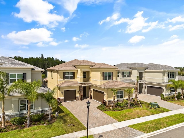 view of front facade with a front yard and a garage