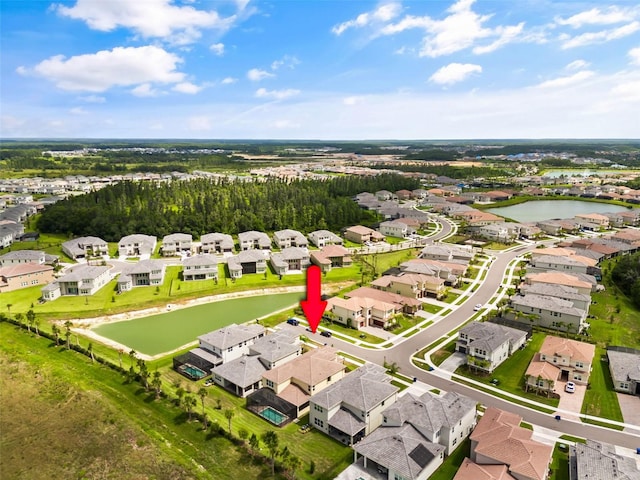 birds eye view of property featuring a water view