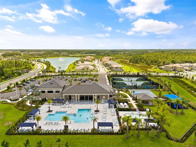 birds eye view of property with a water view