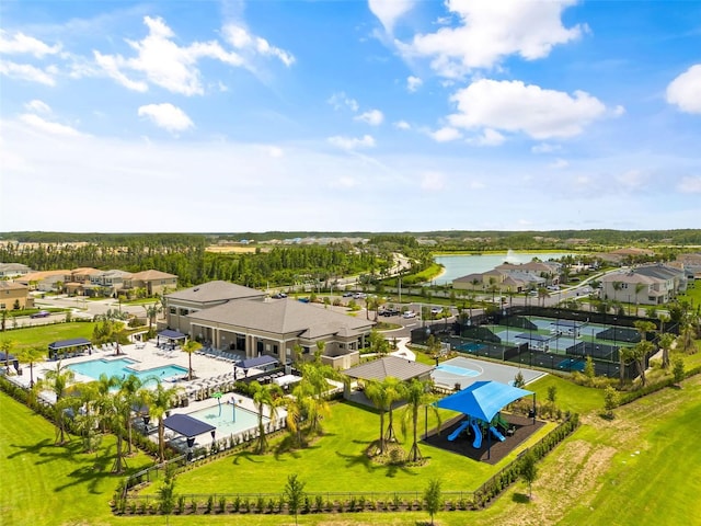 birds eye view of property with a water view