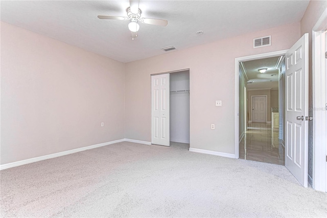 unfurnished bedroom with a textured ceiling, a closet, and ceiling fan