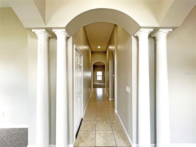 corridor with light tile patterned floors