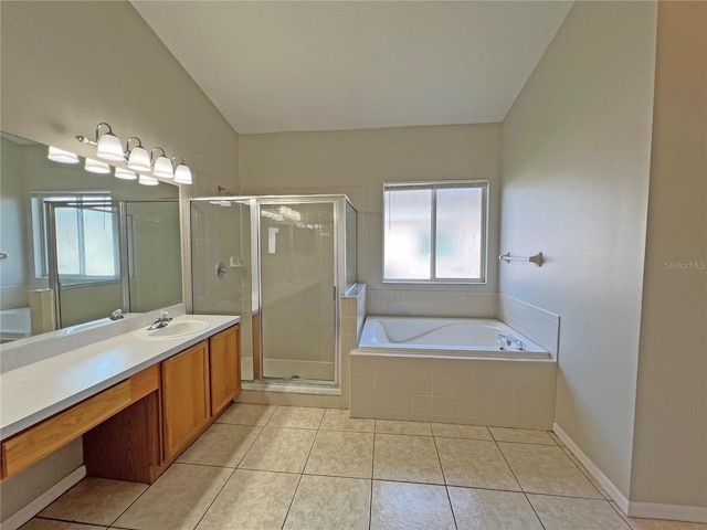 bathroom featuring tile patterned flooring, vanity, and shower with separate bathtub