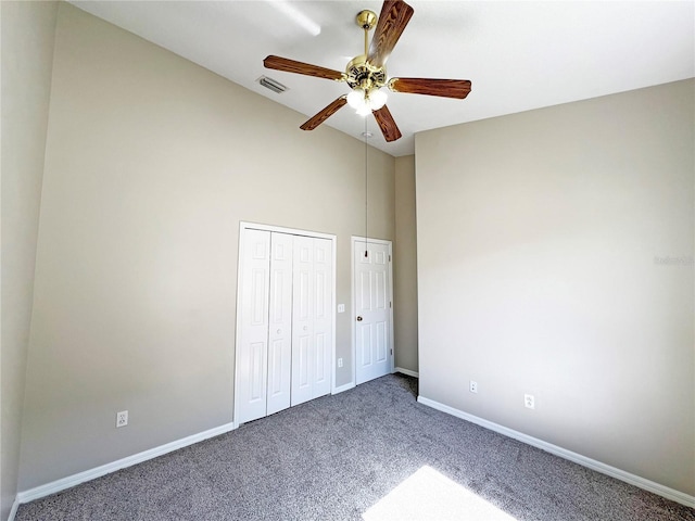 unfurnished bedroom with ceiling fan and carpet floors