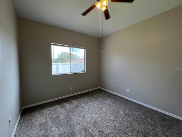 carpeted empty room featuring ceiling fan