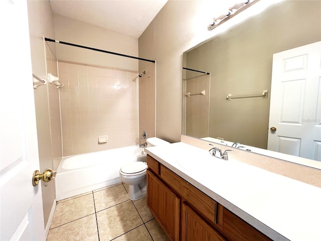 full bathroom with tile patterned flooring, vanity, tiled shower / bath combo, and toilet