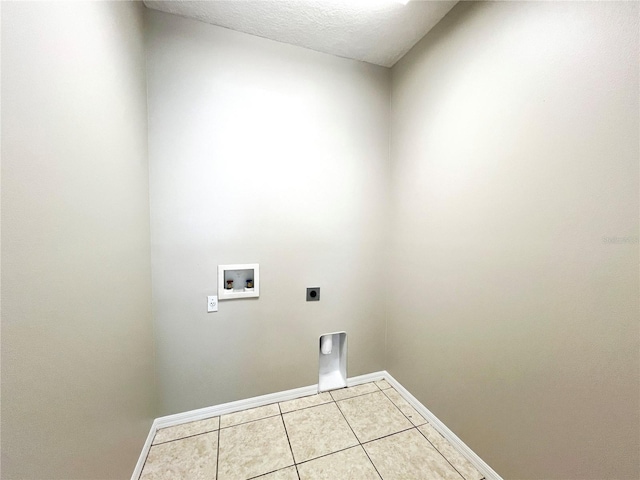 laundry room featuring hookup for an electric dryer, washer hookup, and light tile patterned floors